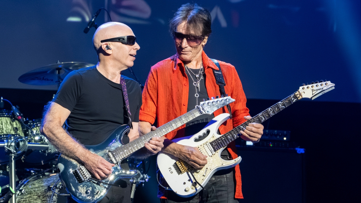 Steve Vai and Joe Satriani performing together.